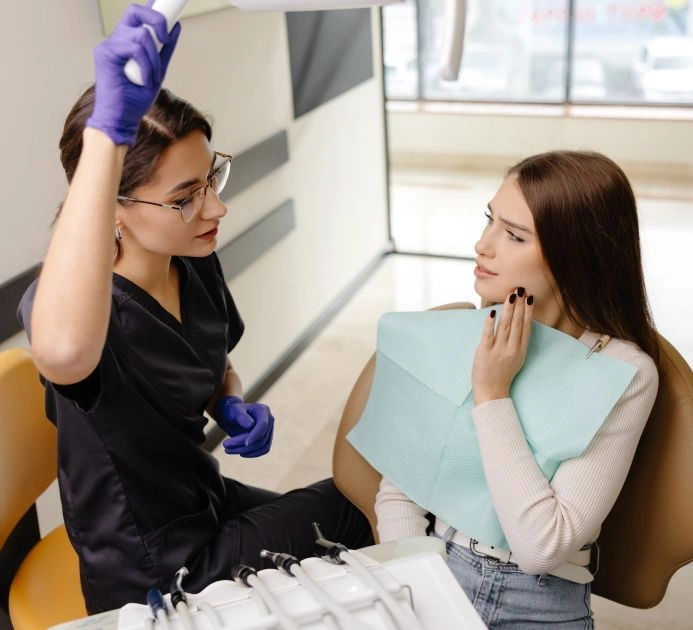 A tmj specialist sitting with a patient
